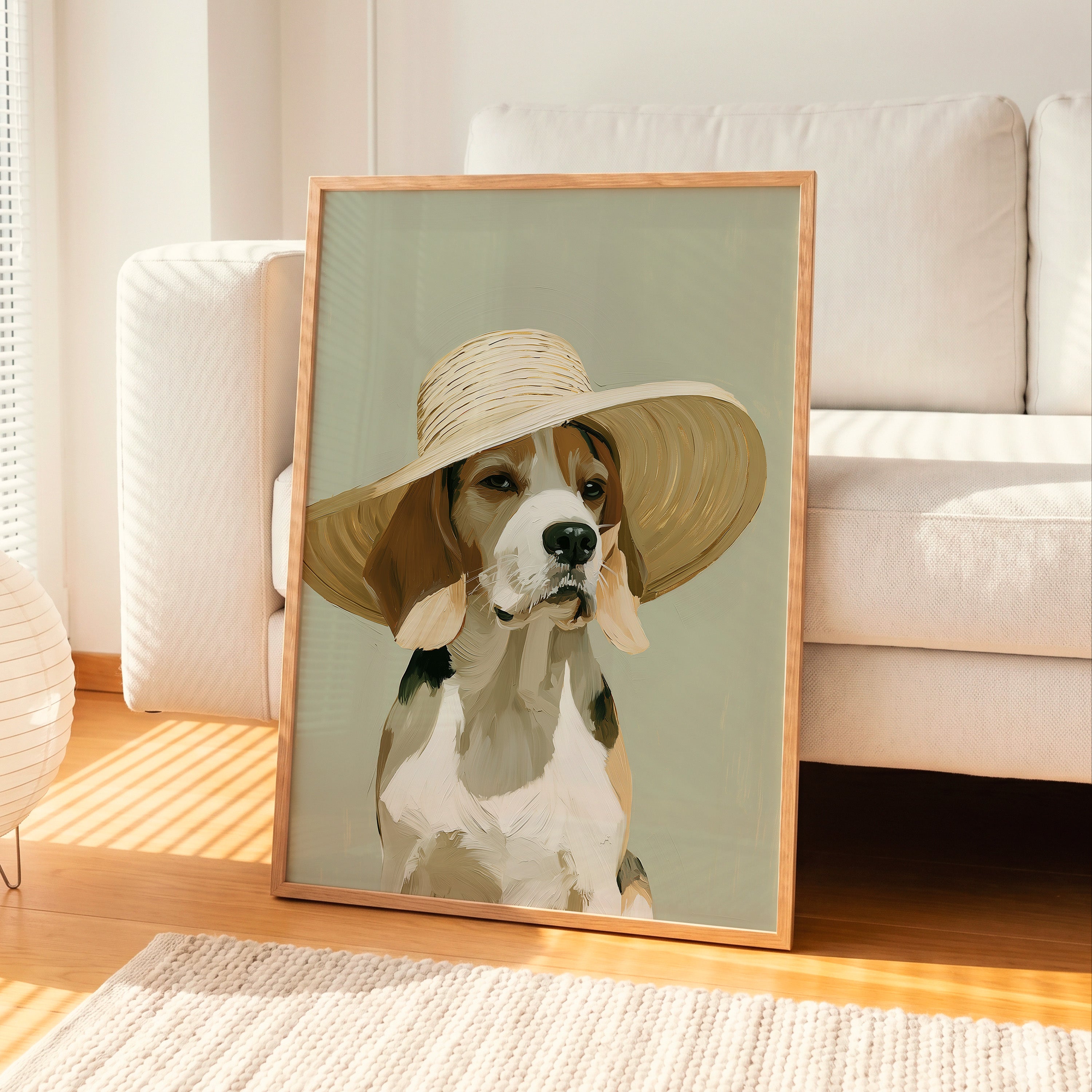 A contemporary oil-style art print of a beagle wearing an oversized wide brim straw hat, painted in warm tricolour tones against a soft sage green background with expressive brushwork.