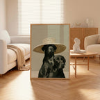 Framed artwork of two dogs wearing hats in a living room setting.